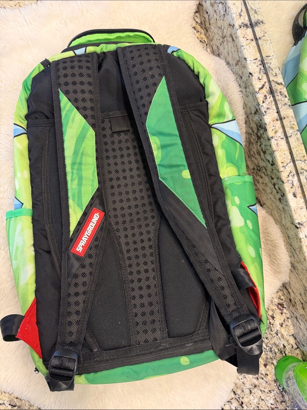 Sprayground Rick Face Backpack in Green, Black, Red, Blue - Picture 2 of 4